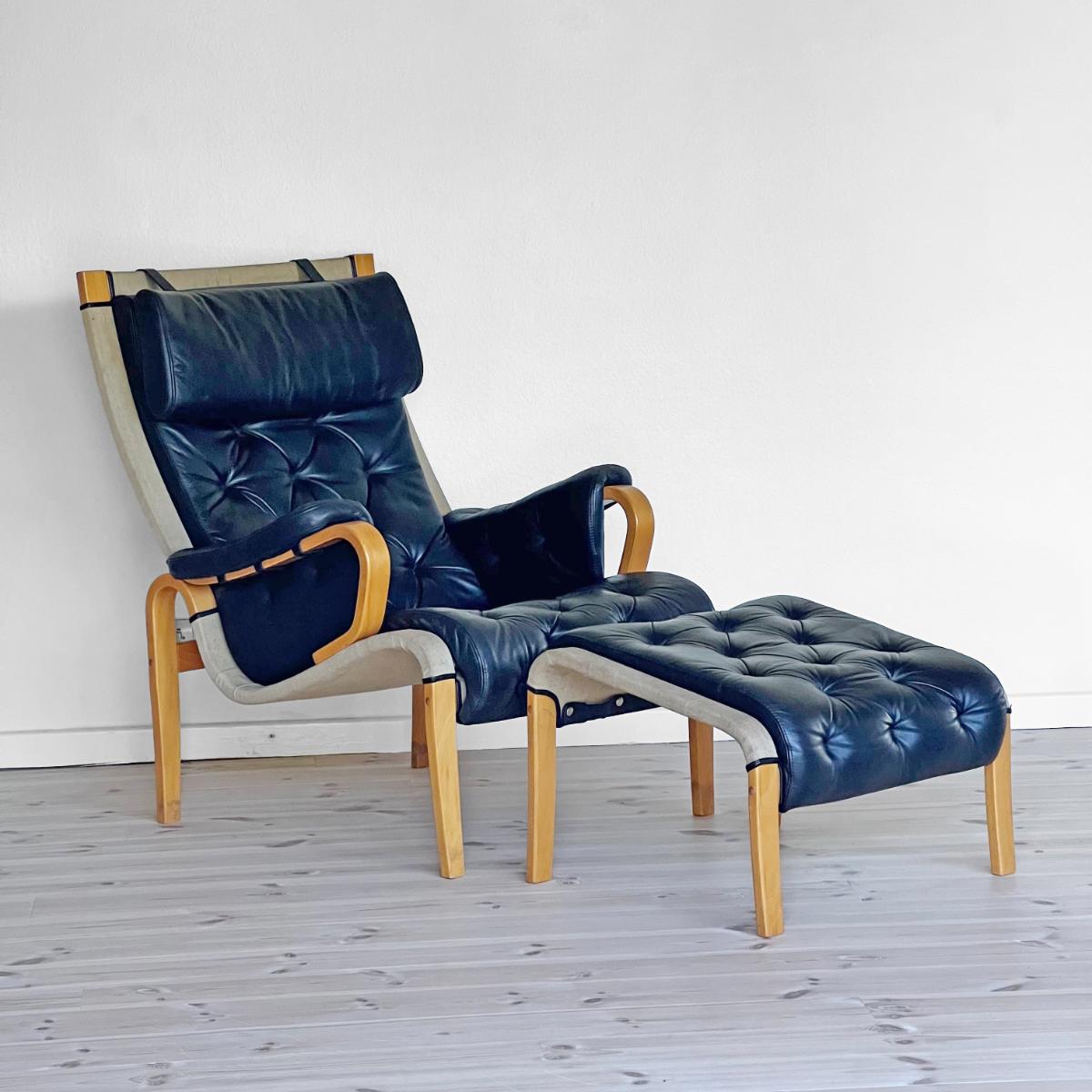 Un lounge chair et son ottoman par Nielaus & Jeki Møbler - Leather - 1980s